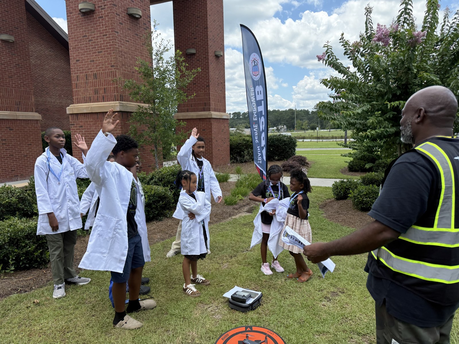 James Smith teaching students to fly a drone
